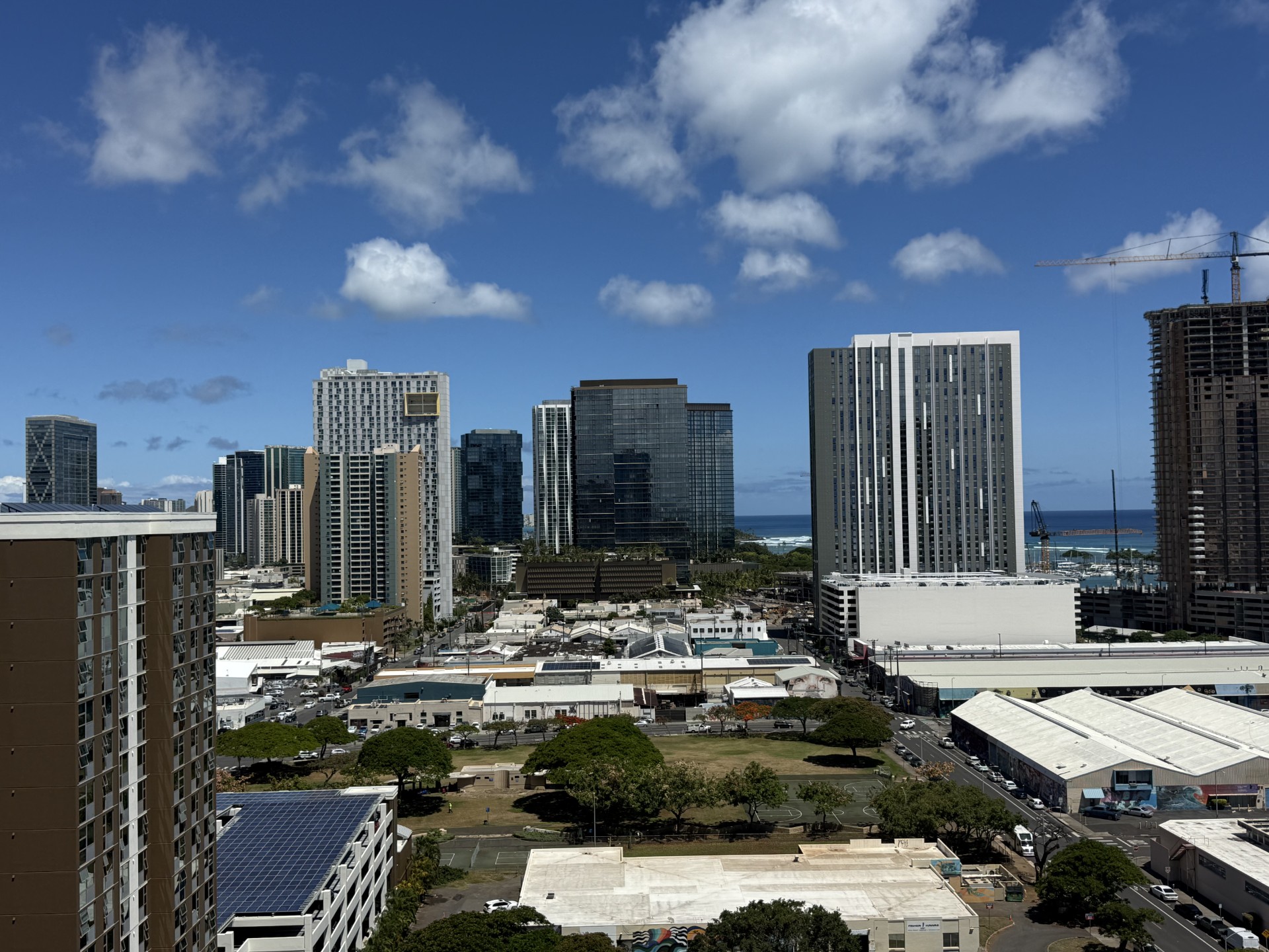 A cityscape with tall buildings and a clear sky.